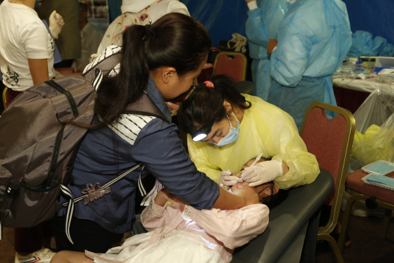 Research team member Dr Phoebe Lam undergoes regular oral checkup for a kid 